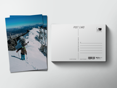 Почтовая открытка «Горнолыжник на снежном хребте»